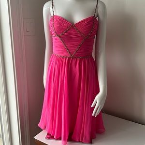 hot pink cocktail dress trimmed with colorful stones. Size 4